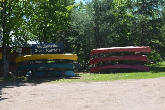 Canoes sit on racks.