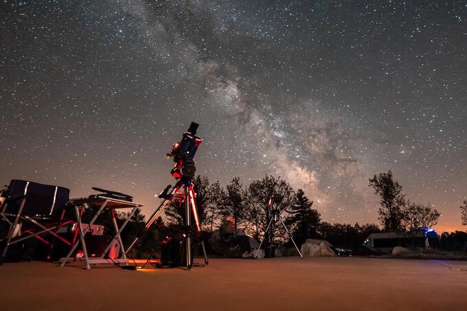 telescopes pointed at starry sky