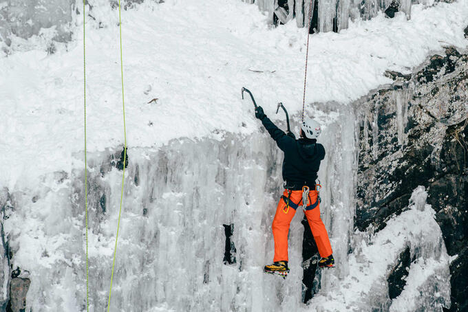 distance shot of Lorne Foisy climbing ice wall