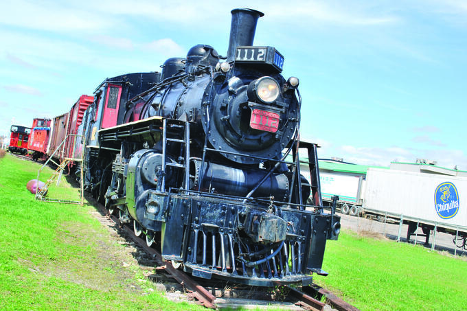 A train locomotive sits on the tracks.
