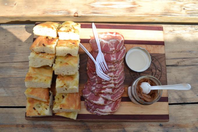 charcuterie board covered in italian bread and cured meat
