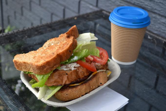 delicious-looking sandwich and coffee to go