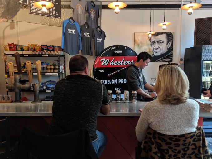 A couple chats with a bartender at Stalwart Brewing Co.