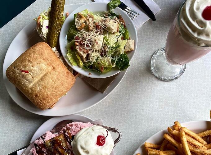 Zak's Diner in Carleton Place shows a table laden with food.