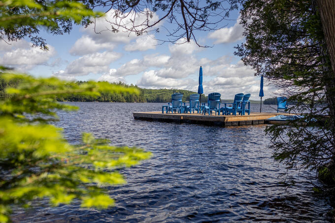 A dock is shown on a lake