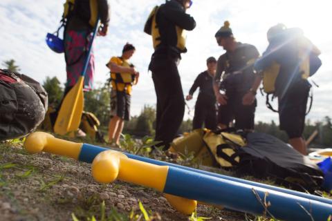 paddlers putting on lifejackets