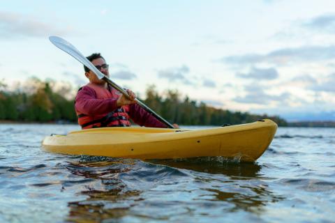 Man paddling in lake