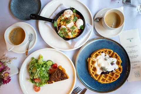 A table is set with breakfast dishes.